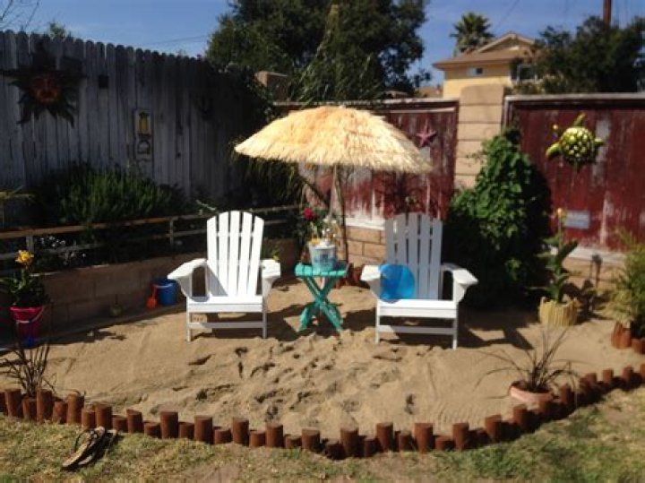 How do you make a sand beach in your backyard?